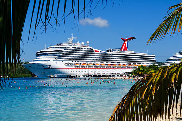 Roatan, Honduras - March 23, 2011: The M.S. Carnival Valor, owned by Carnival Cruise Lines, docked at Mahogany Bay on the Caribbean island of Roatan.